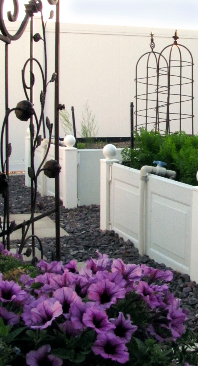 A decorative iron tomato cage. www.lifeatthecottage.com