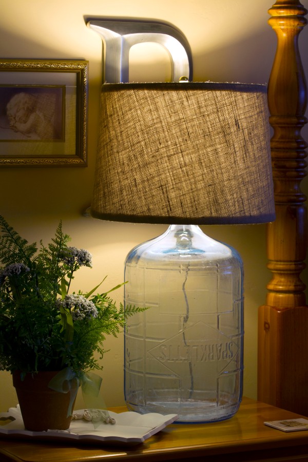 A large glass water bottle made into a lamp. www.lifeatthecottage.com